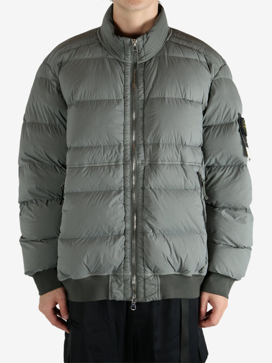 Grey jacket worn by a person, showing the jacket's fit