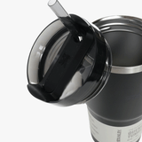 Close up of black tumbler, showing texture of the stainless steel fabric