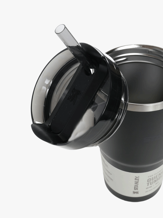 Close up of black tumbler, showing texture of the stainless steel fabric