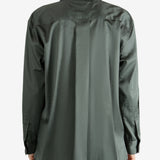 Green shirt worn by a person, showing the shirt's fit