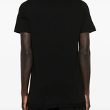 Black t-shirt worn by a person, showing the shirt's fit