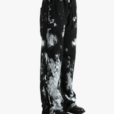 Black pants worn by a person, showing the pants' fit