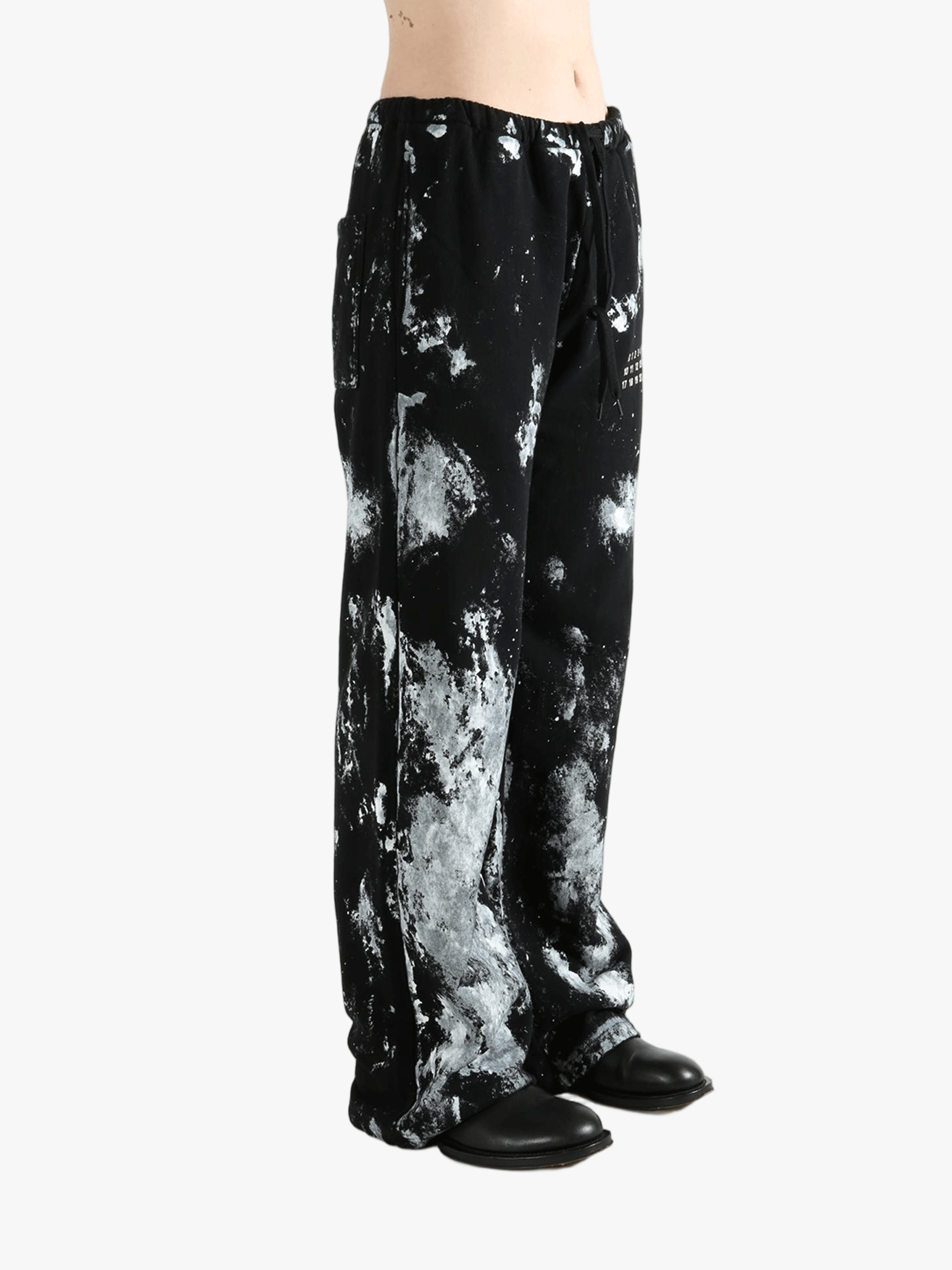 Black pants worn by a person, showing the pants' fit