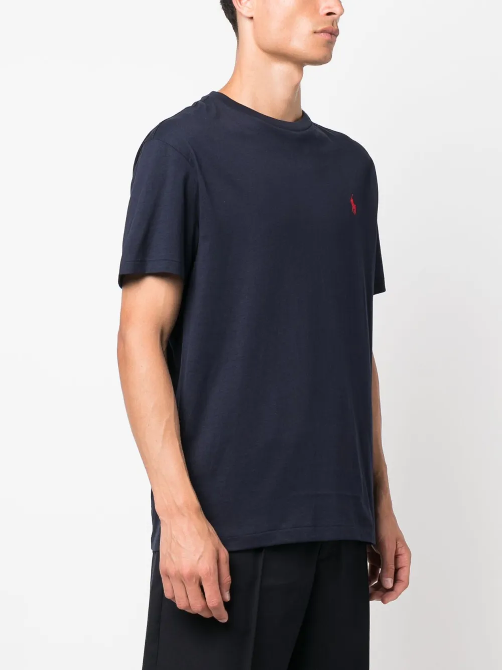 Navy t-shirt worn by a person, showing the shirt's fit