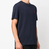Navy t-shirt worn by a person, showing the shirt's fit