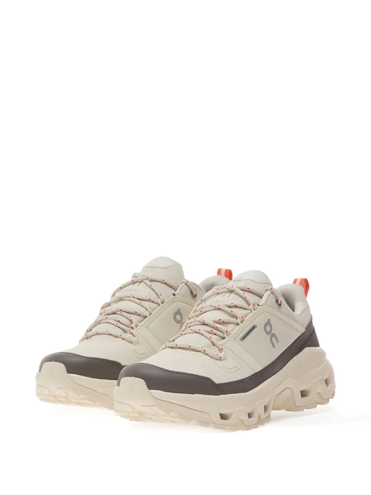 Tan sneakers, side view