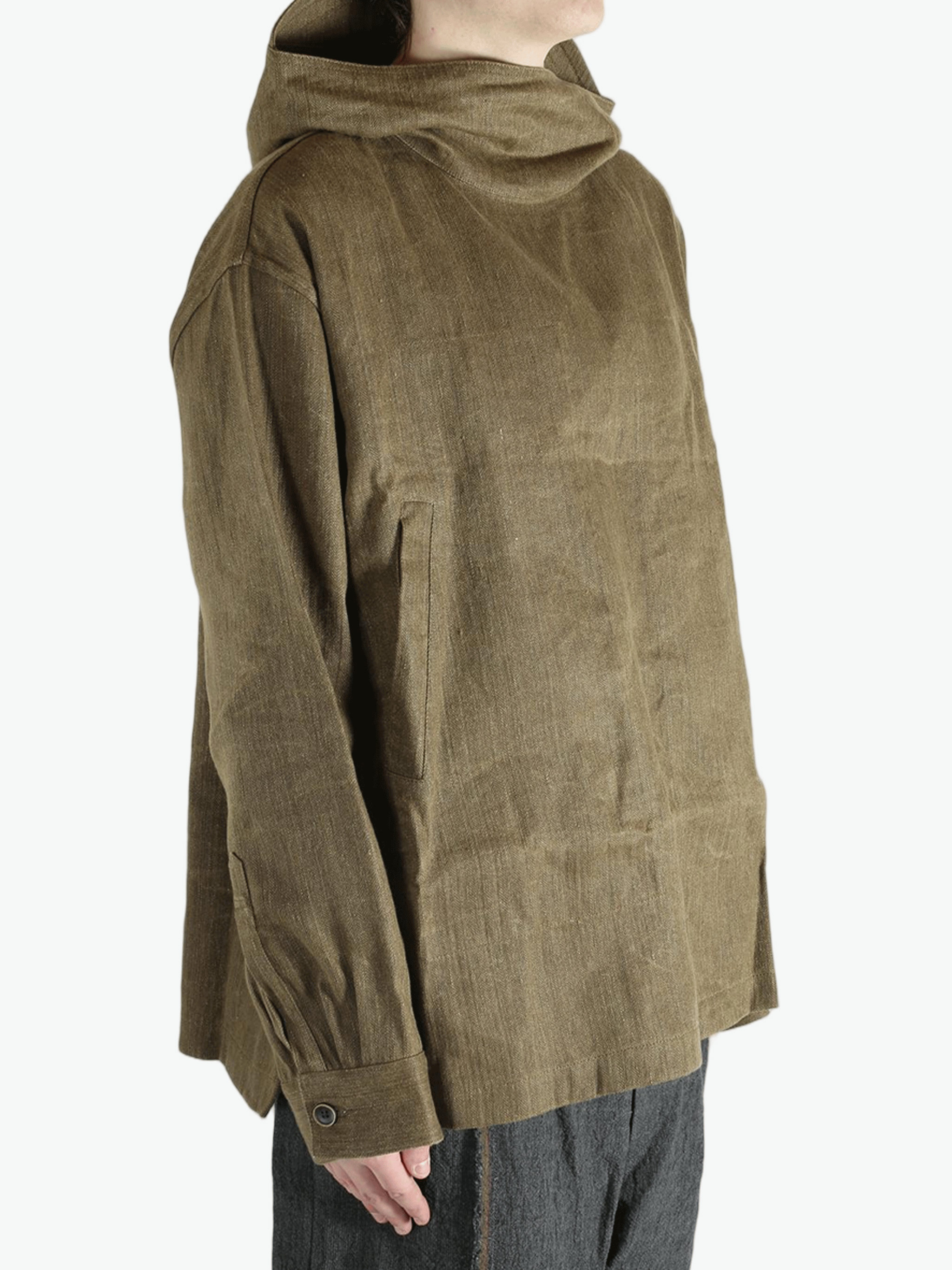 Brown jacket worn by a person, showing the jacket's fit