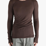 Brown t-shirt worn by a person, showing the shirt's fit