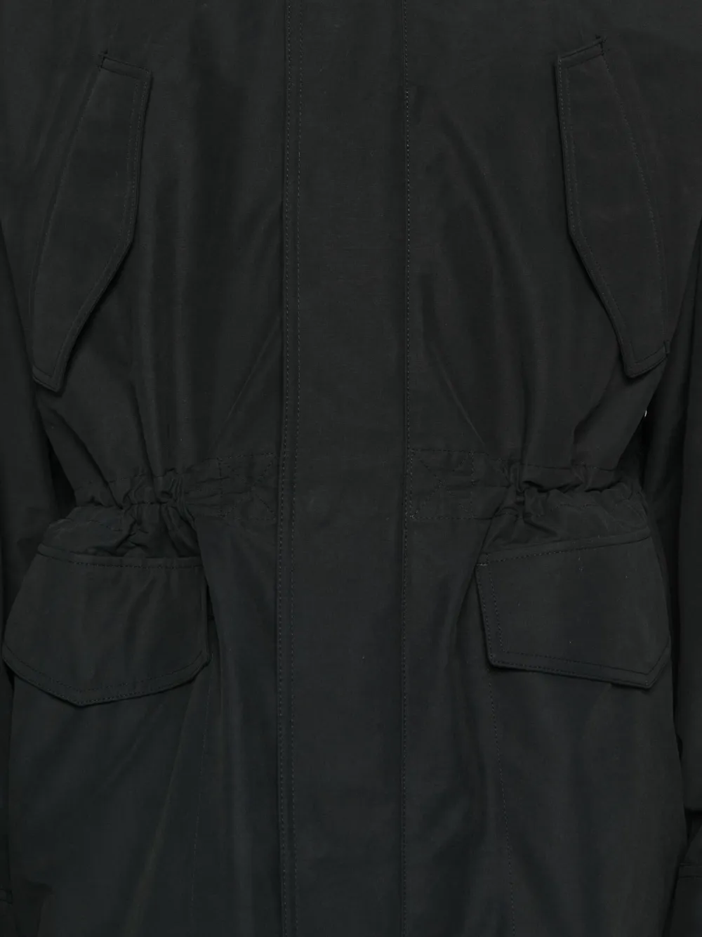 Close up of black jacket,showing texture of the cotton fabric.
