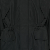 Close up of black jacket,showing texture of the cotton fabric.