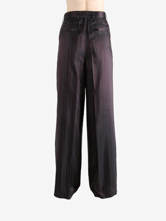 Red pant worn by a person, showing the pant's fit