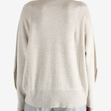 Grey knitwear worn by a person, showing the knitwear fit