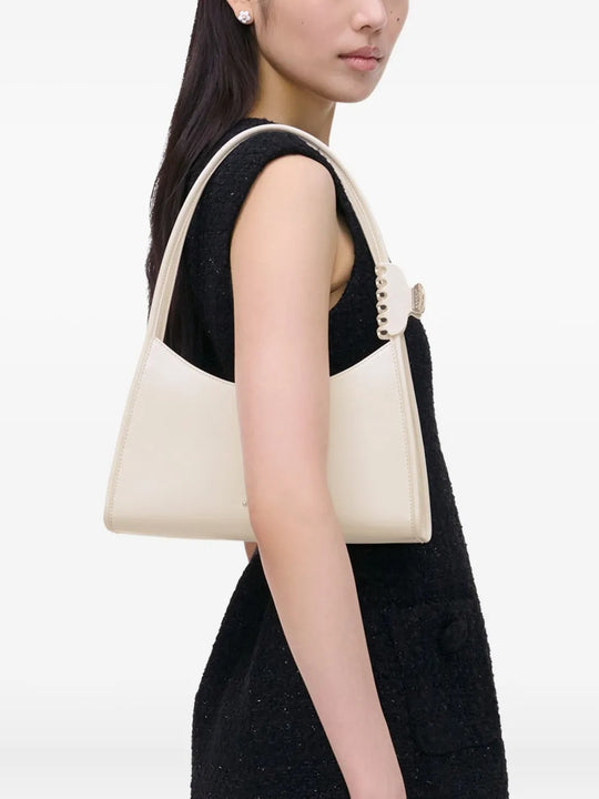 White bag worn by a person, showing the bag's fit