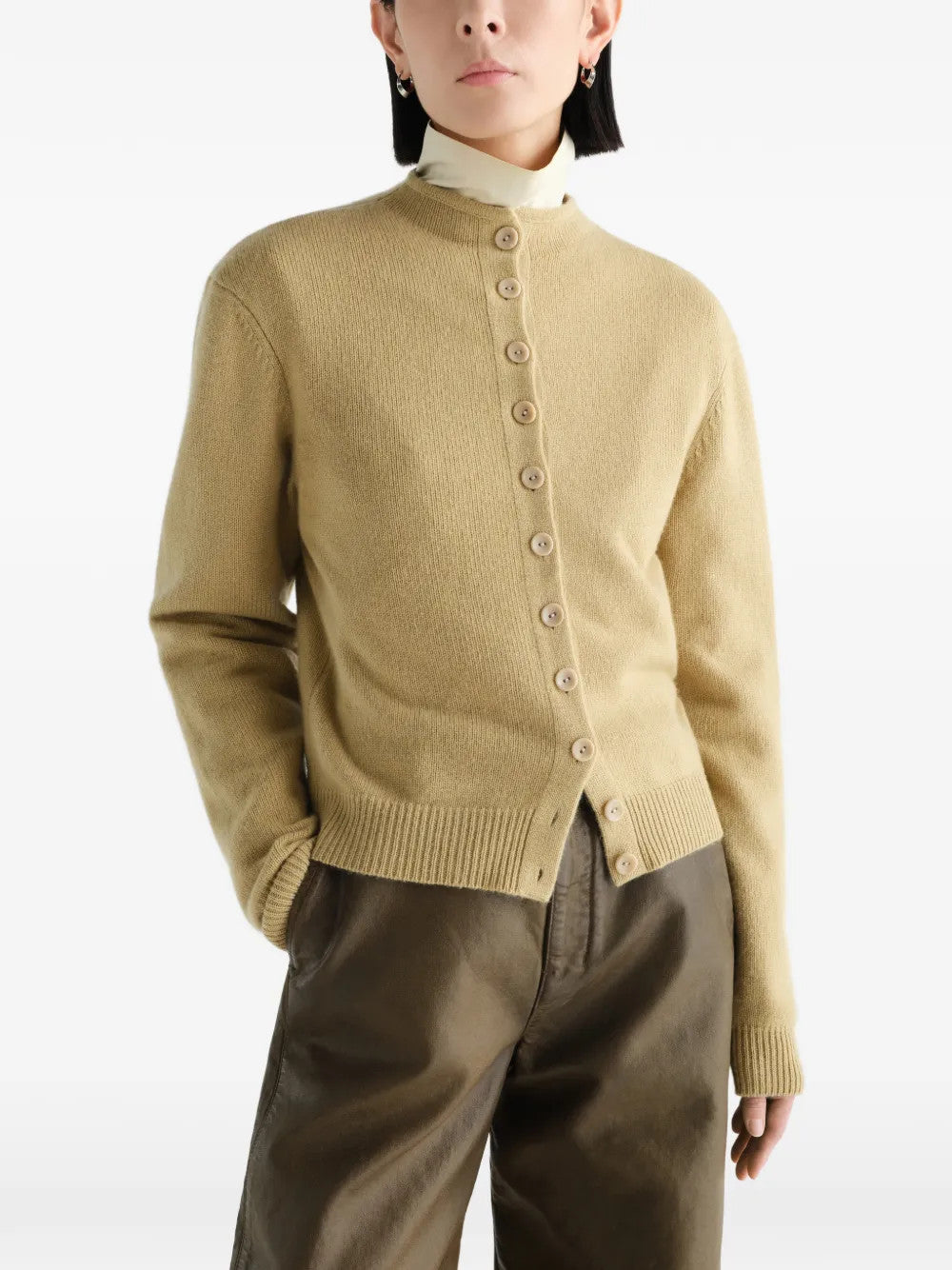 Tan hoodie worn by a person, showing the hoodie fit