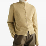 Tan hoodie worn by a person, showing the hoodie fit