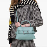 Blue bag worn by a person, showing the bag's fit