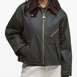 Green jacket worn by a person, showing the jacket fit