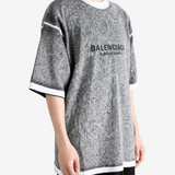 Grey t-shirt worn by a person, showing the t-shirt fit