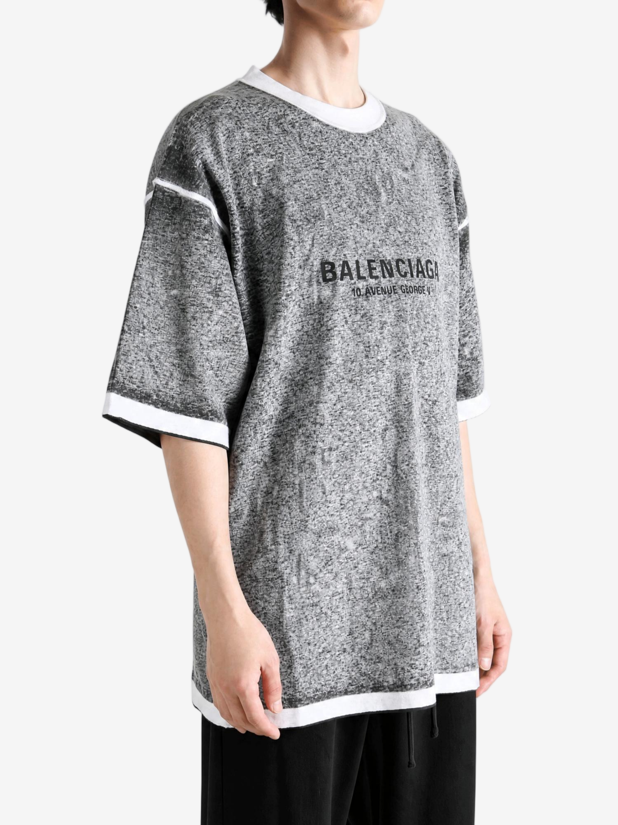 Grey t-shirt worn by a person, showing the t-shirt fit