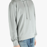 Grey hoodie worn by a person, showing the hoodie fit