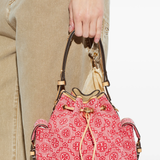 Red bag worn by a person, showing the bag's fit