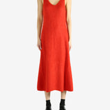 Red dress worn by a person, showing the dress's fit