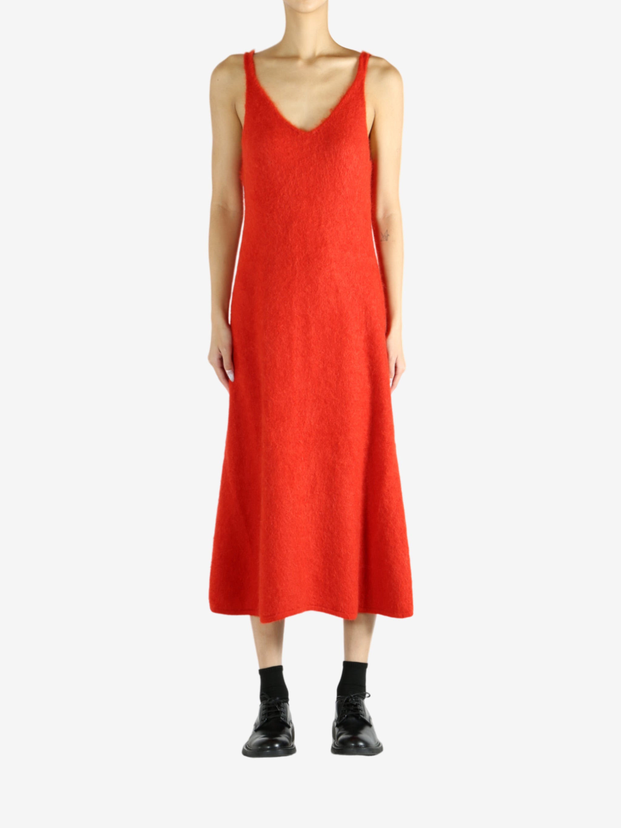 Red dress worn by a person, showing the dress's fit