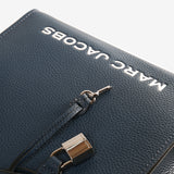 Close up of navy bag,showing texture of the leather fabric