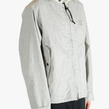 Light gray jacket worn by a person, showing the jacket fit