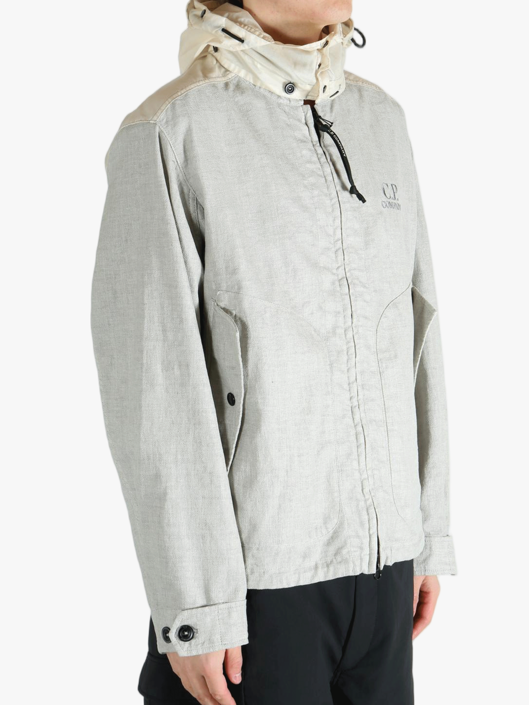 Light gray jacket worn by a person, showing the jacket fit