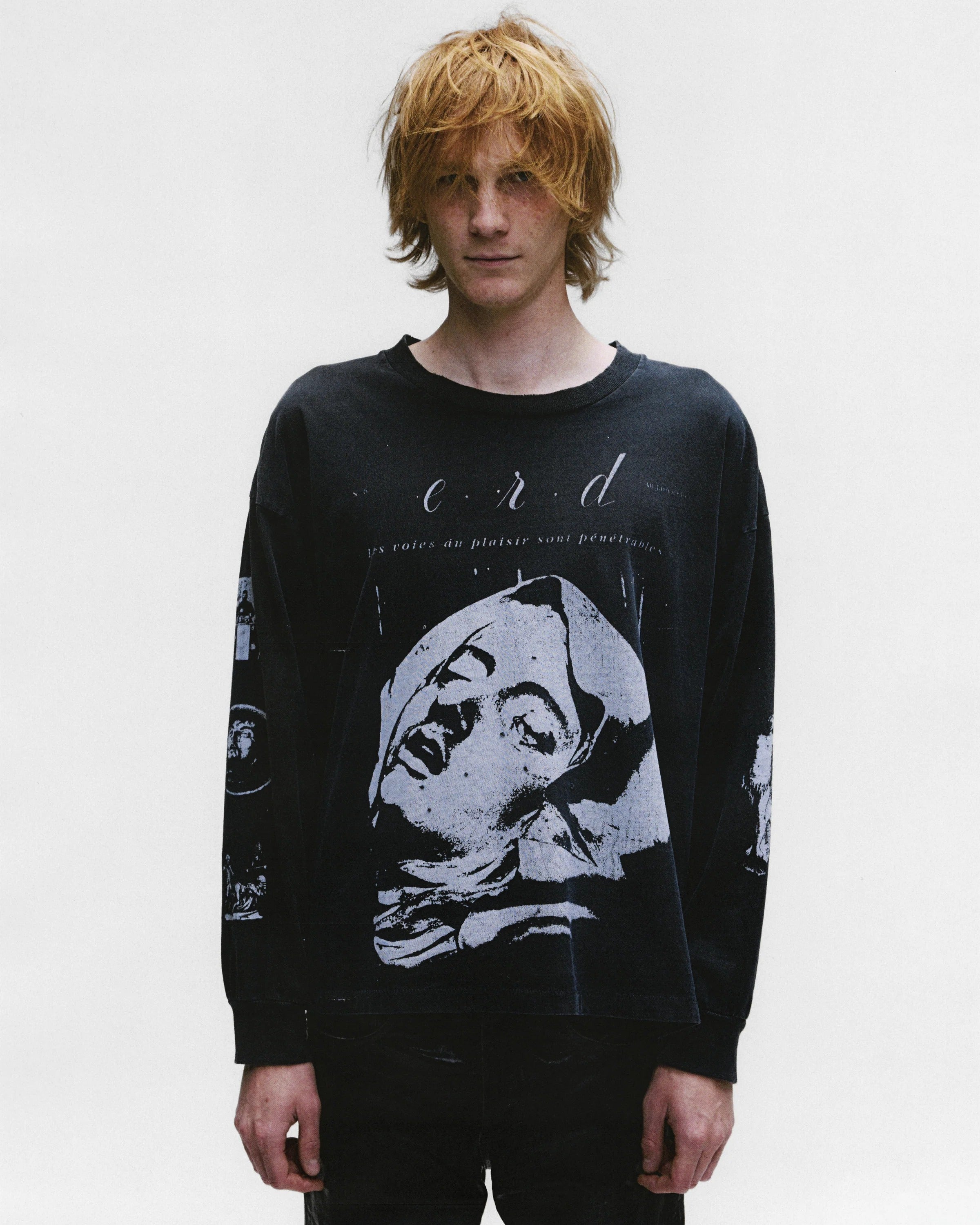 Black shirts worn by a person, showing the shirts fit