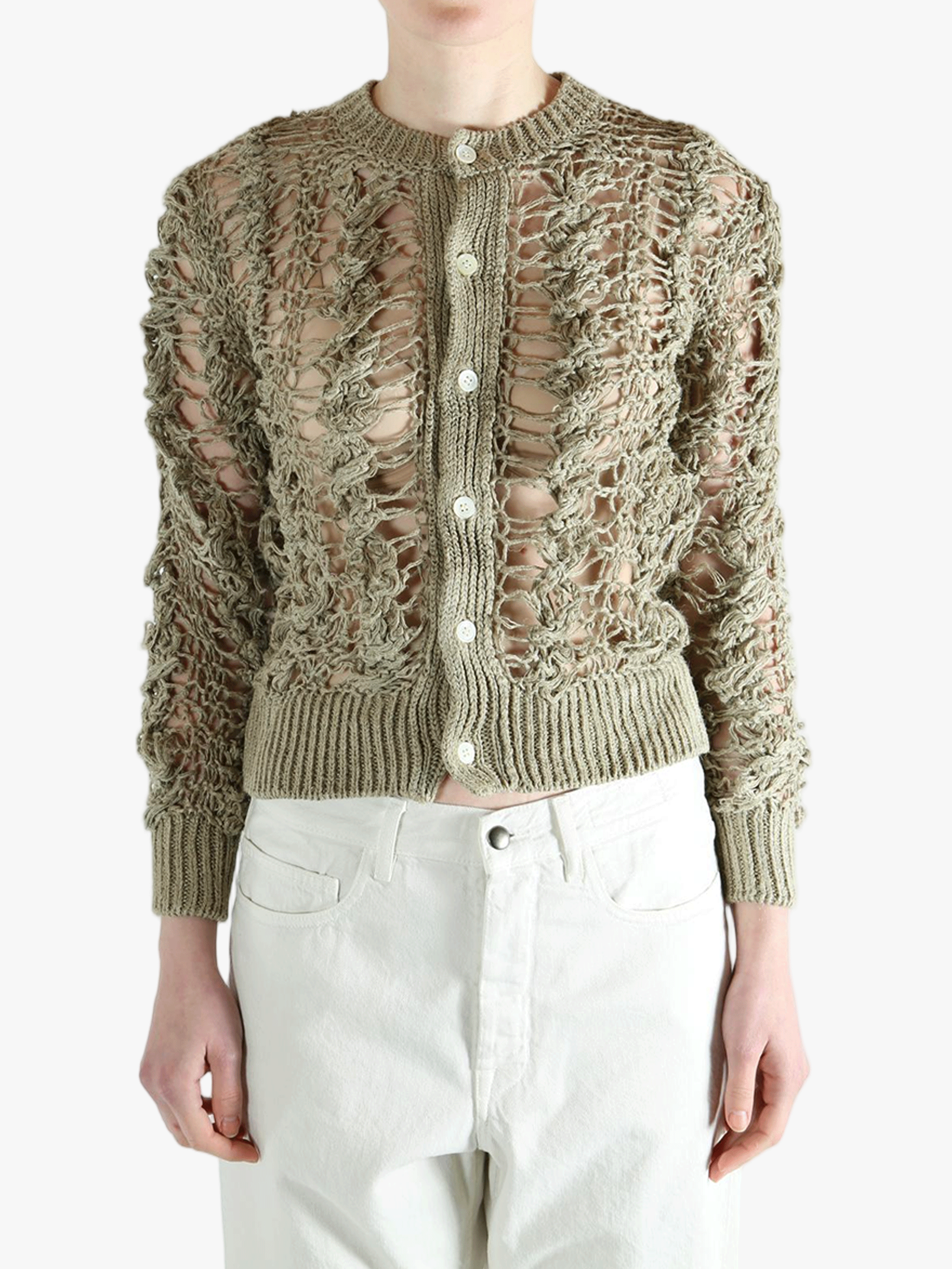 Green knitwear worn by a person, showing the knitwear fit