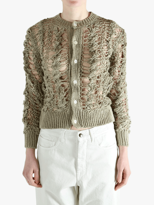 Green knitwear worn by a person, showing the knitwear fit