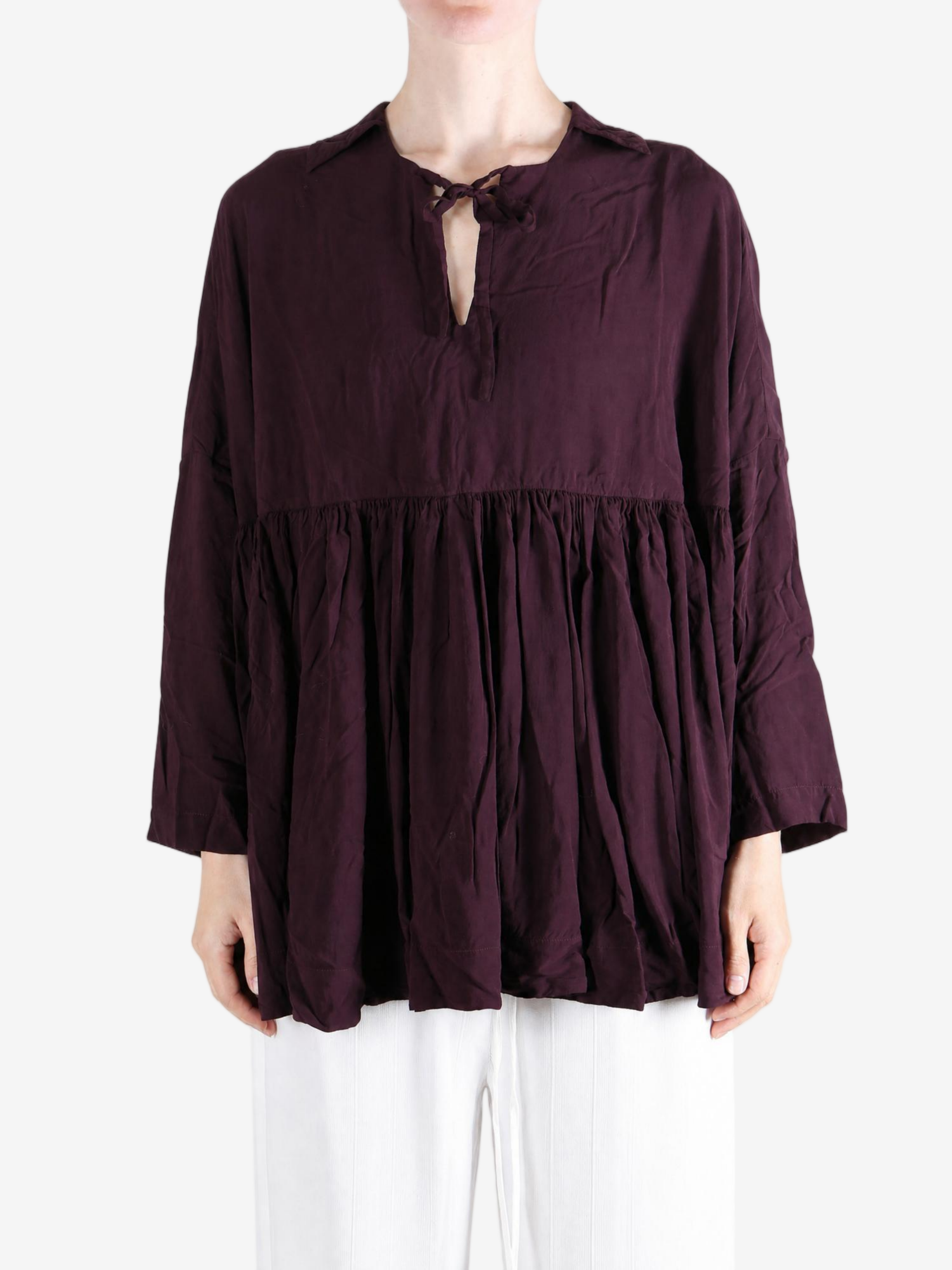 Burgundy top worn by a person, showing the top fit