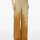 Brown pants worn by a person, showing the pants fit