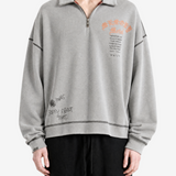 Grey hoodie worn by a person, showing the hoodie fit
