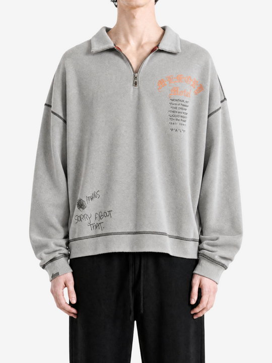 Grey hoodie worn by a person, showing the hoodie fit
