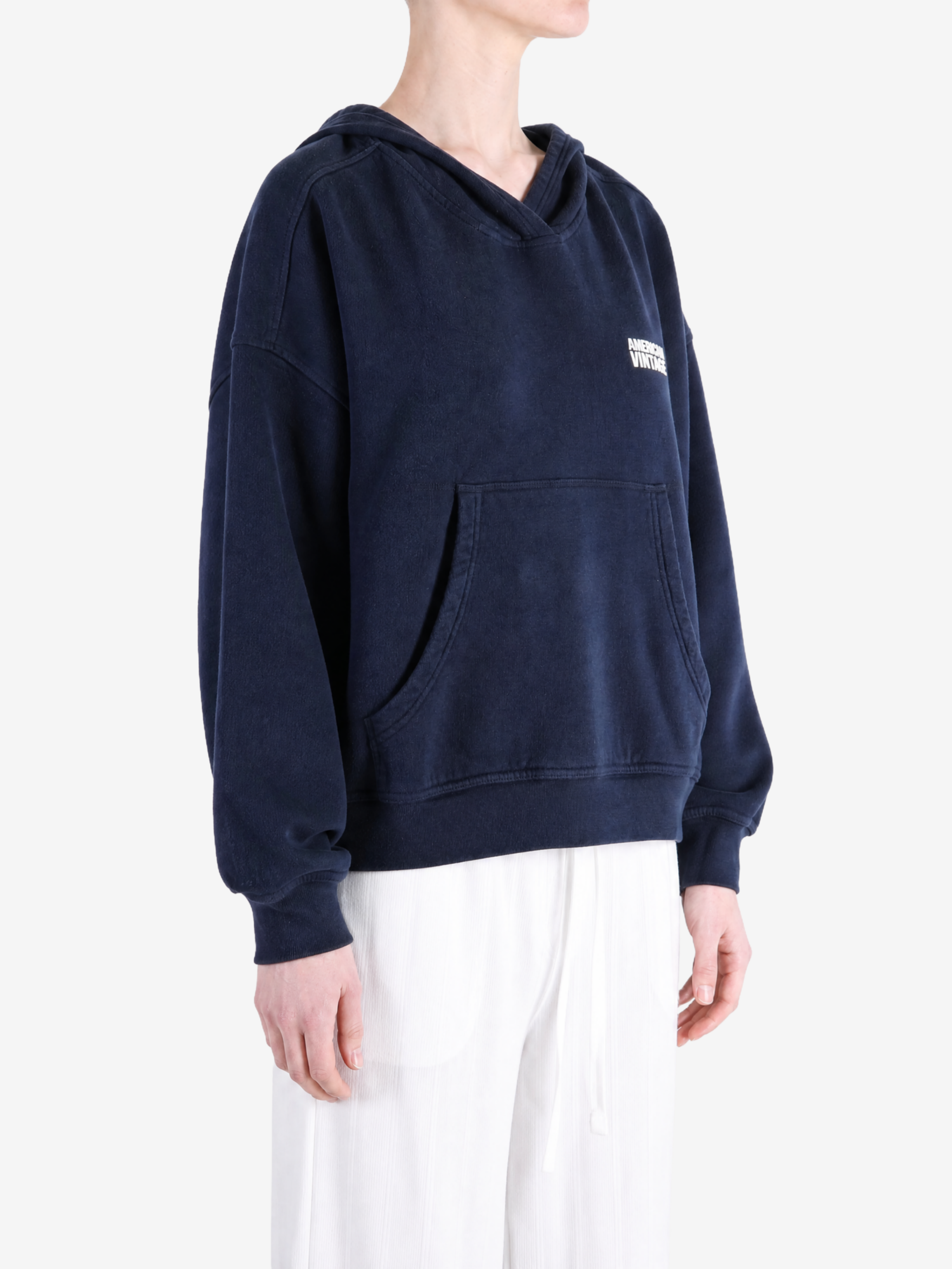 Navy hoodie worn by a person, showing the hoodie fit
