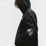 Black jacket worn by a person, showing the jacket's fit