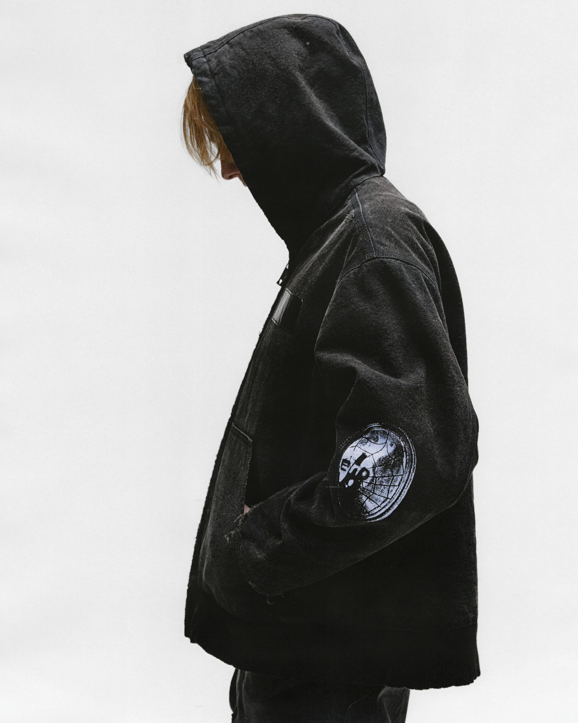 Black jacket worn by a person, showing the jacket's fit