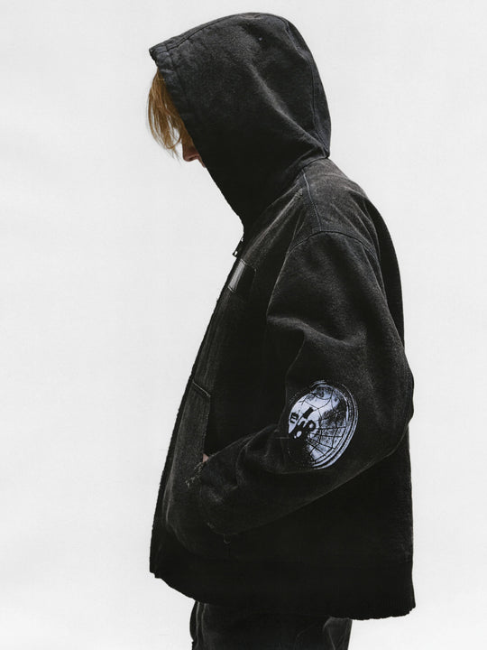 Black jacket worn by a person, showing the jacket's fit