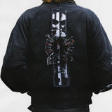 Black jacket worn by a person, showing the jacket's fit