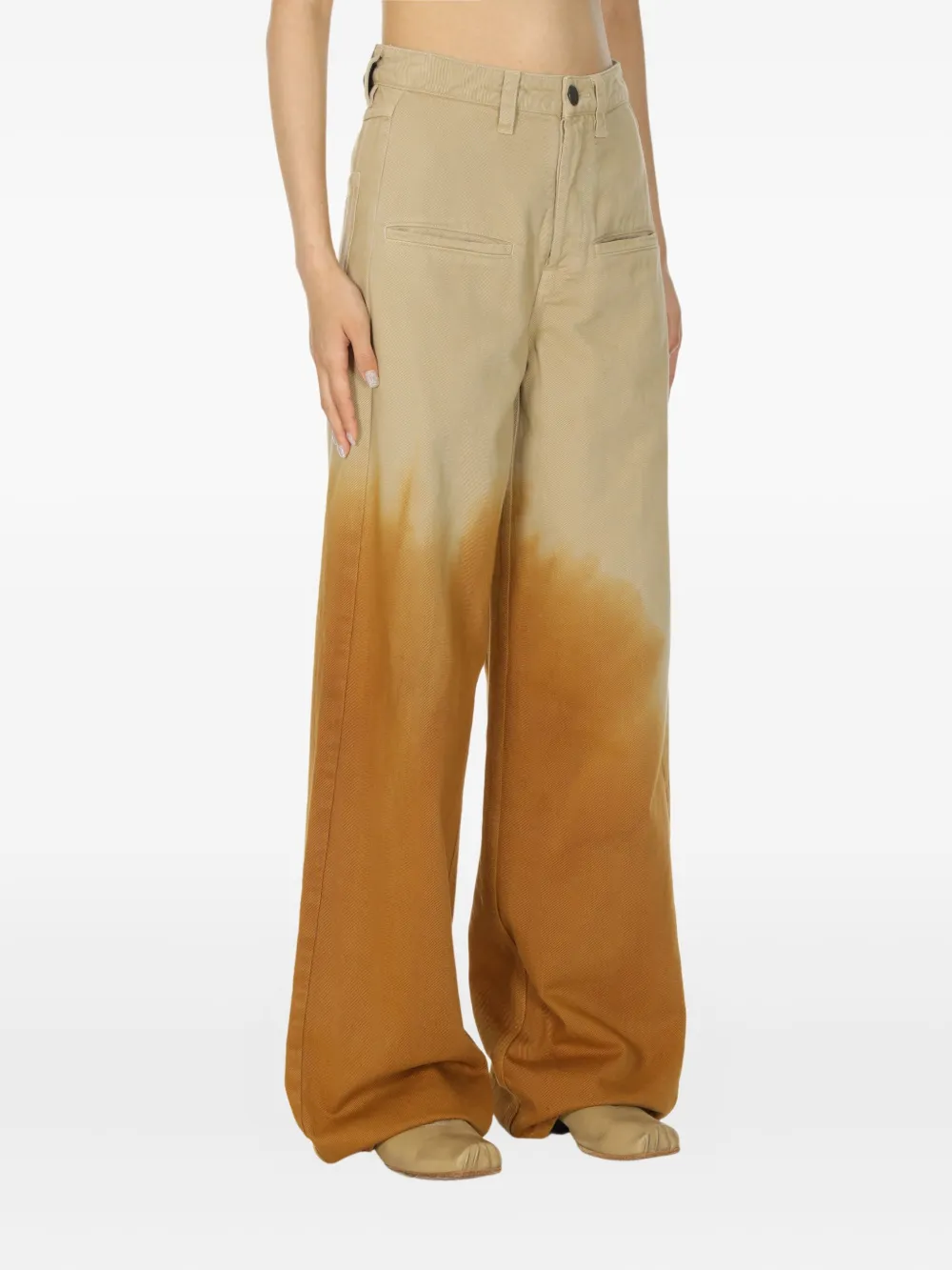 Brown pants worn by a person, showing the pants fit