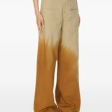 Brown pants worn by a person, showing the pants fit