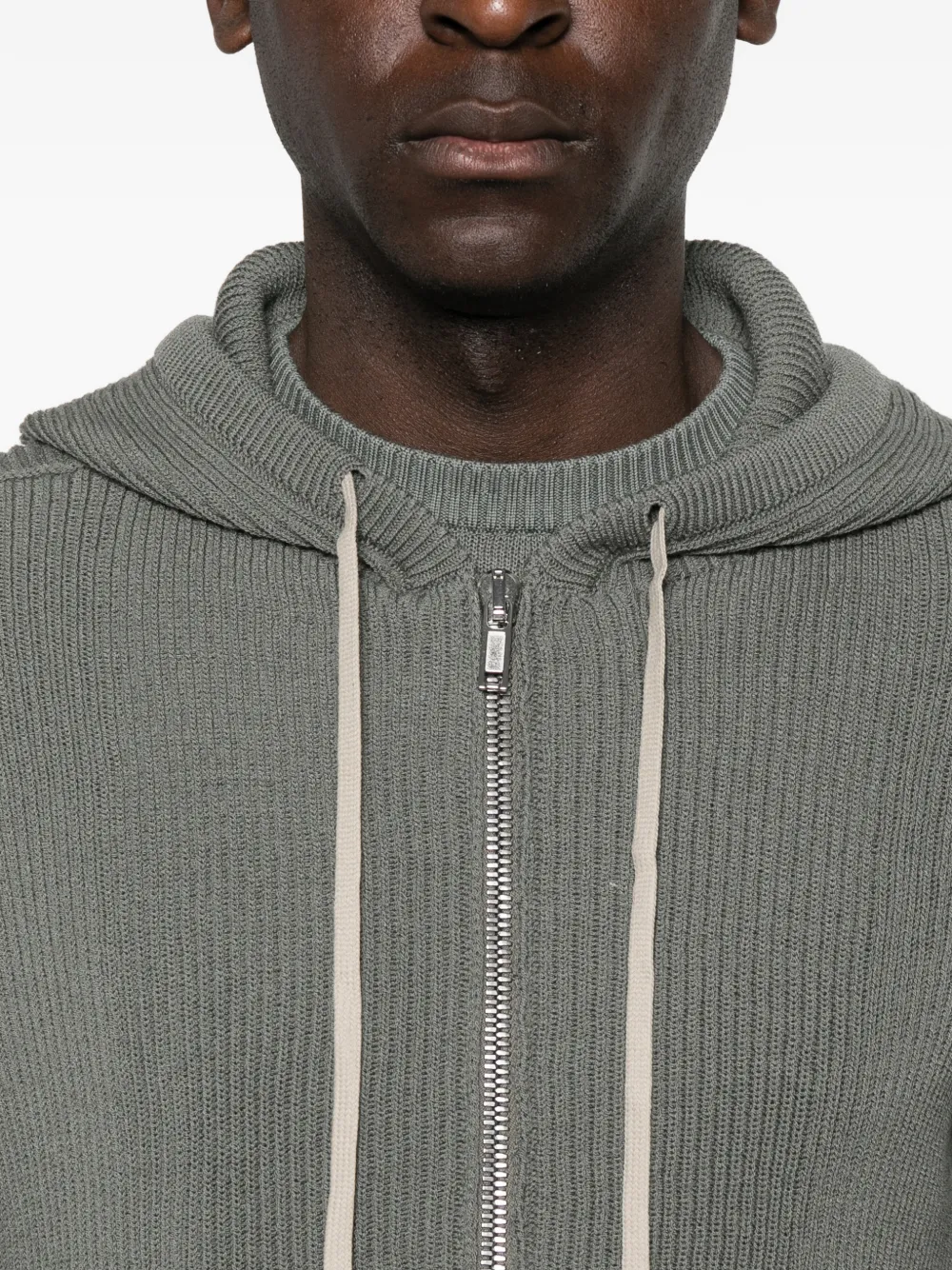 Grey hoodie worn by a person, showing the hoodie fit
