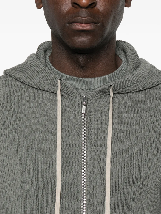 Grey hoodie worn by a person, showing the hoodie fit