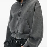 Grey hoodie worn by a person, showing the hoodie fit