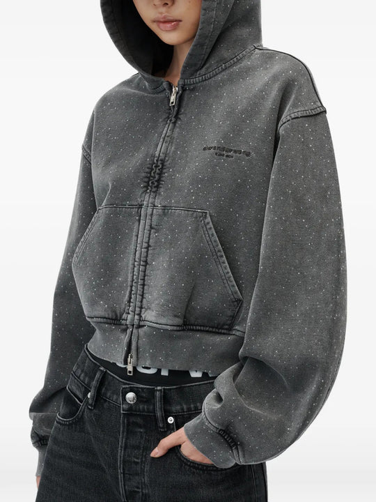 Grey hoodie worn by a person, showing the hoodie fit