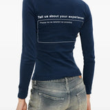 Blue tops worn by a person, showing the tops fit