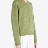 Green hoodie worn by a person, showing the hoodie fit